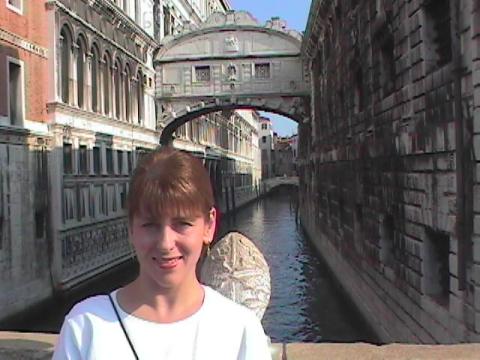 Tammy_in_front_of_sighs_bridge_Venice