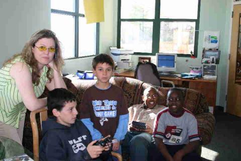 Trish in her office w boys group and AP 06