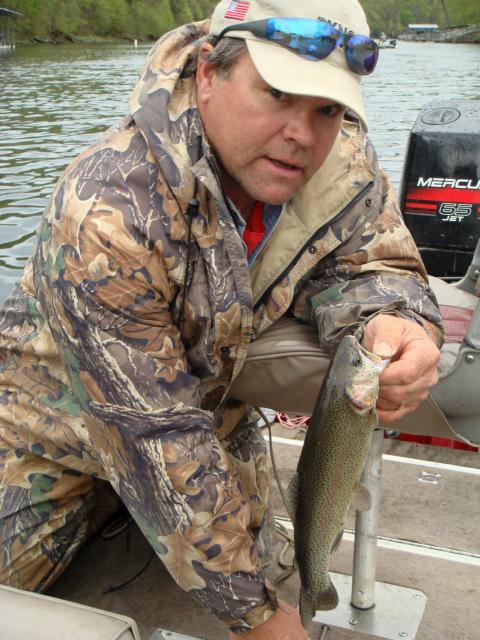 My husband, Gene, catchin' trout at Lake Taneycomo March '07!