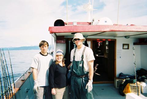 Kim with Taylor and other deckhand, halibut fishing, 4th of July 2003