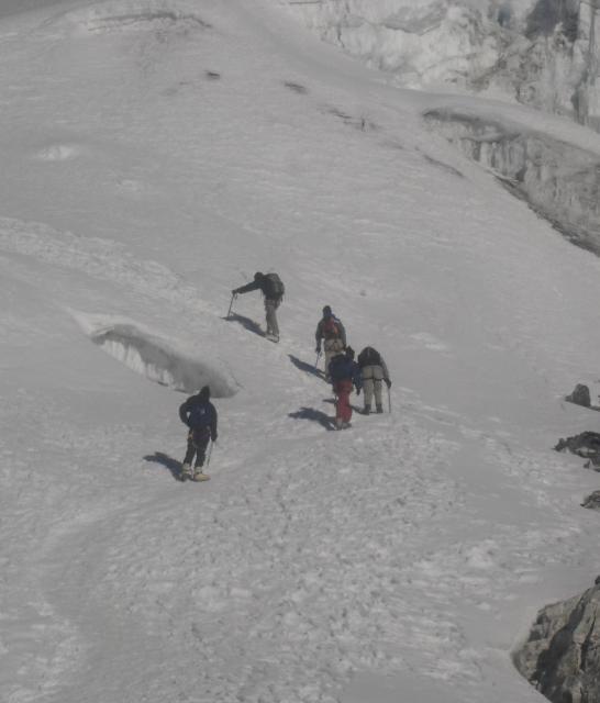 Friends walking on a glacier