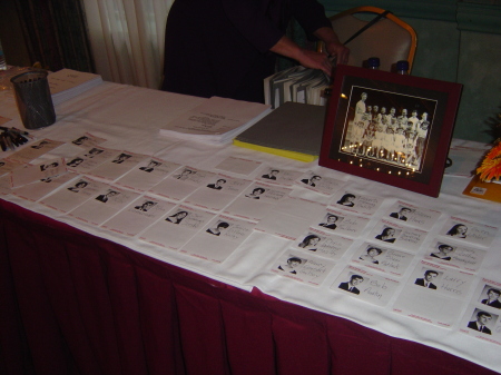 Name tags and slideshow await arrivals