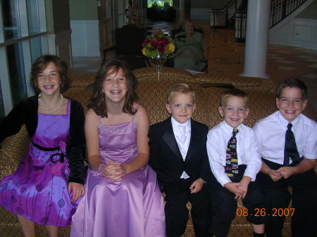 kids hamming it up at a wedding