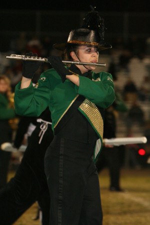 Christina plays flute for school marching band