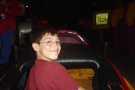 Andrew riding in front of log ride.