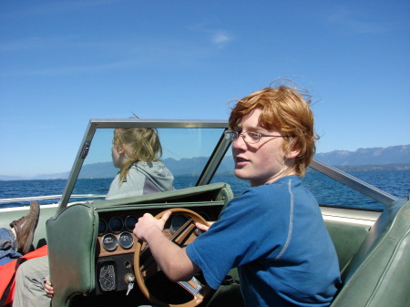 My son Billy driving our boat,