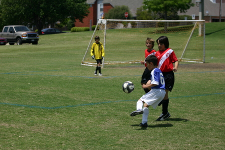 Avery playing soccer