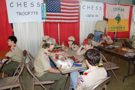 son Luke teaching chess