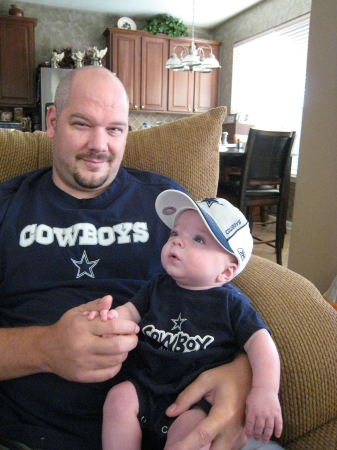 Trey watching Cowboy's with his Daddy