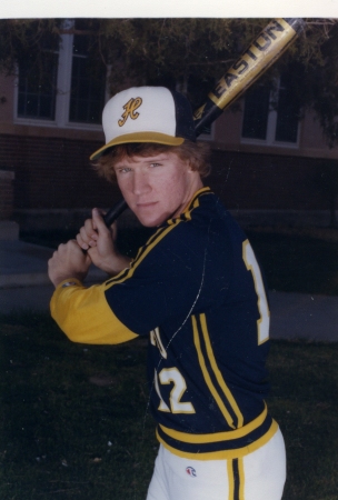 Eyeing the pitcher with a malevolent stare...