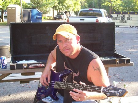 my hubby tunning his bass before the show