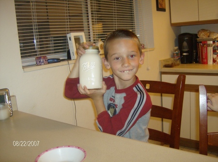 Dominic making butter