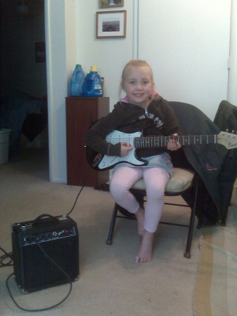 Marley (my granddaughter)First Guitar