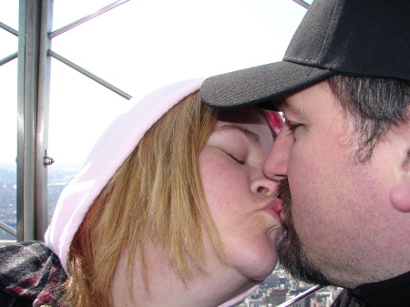 Sharing a kiss on the Empire State Building