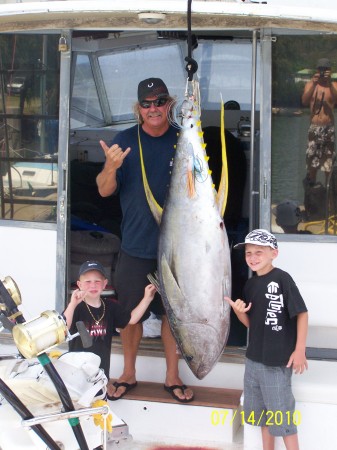 Captain Mark and charter guests with 240lb ahi