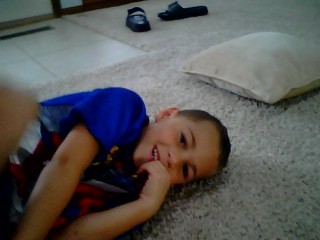 My grandson Isiah playing on the floor