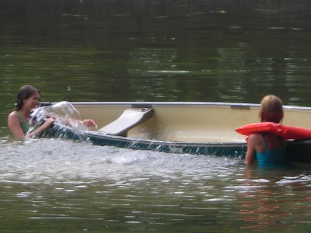 Breanna flips Kayla in canoe