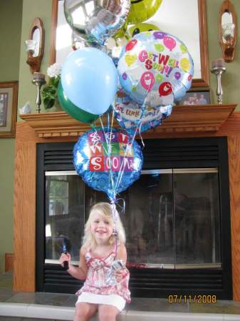 Lizzie with her brothers balloons