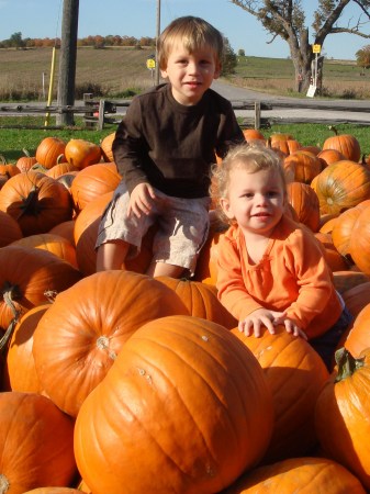 Jackson and Julia picking out a pumpkin
