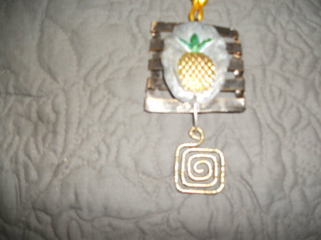 handcrafted pendant using recycled materials