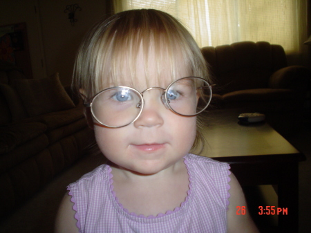 Ashley wearing Daddy's glasses