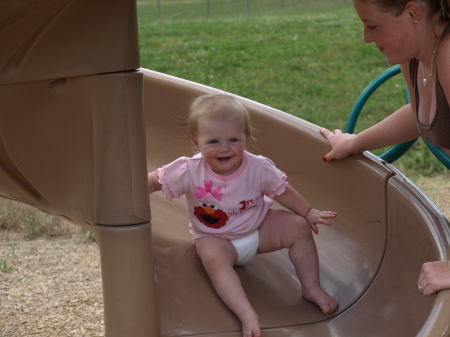 Ryleigh 1st Birthday having fun on slide