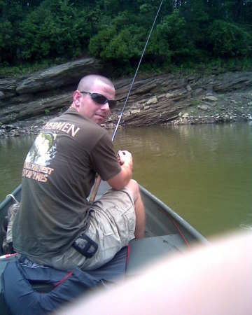 My oldest fishing with Paps