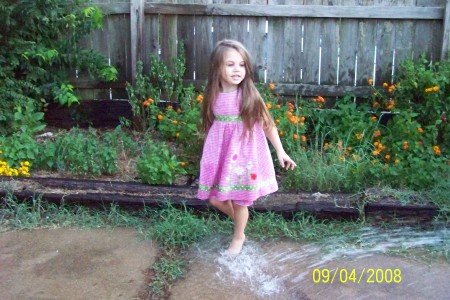 KYAH PLAYING IN THE WATER AT MY HOUSE