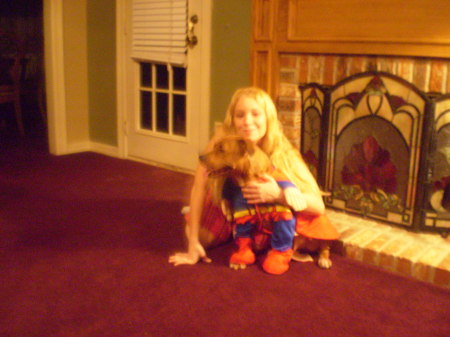 Danielle & the dog,dressed him up as Superman
