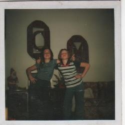 a poloroid of gina and me giving the thumbs-up