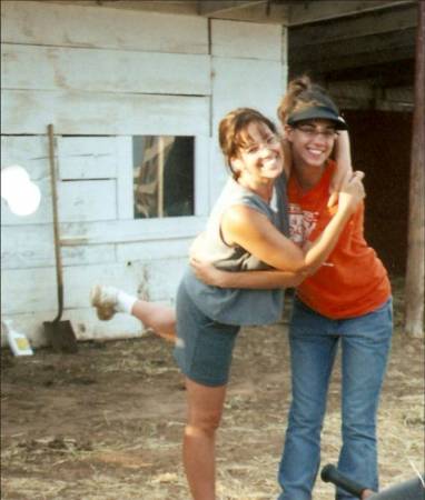 Our daughter Julia, and me cleaning pens