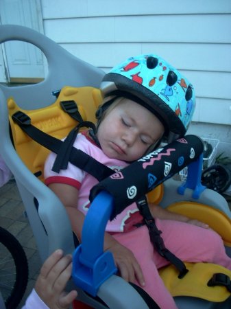 Krista asleep in her bike seat