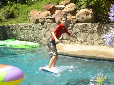 Connor surfing the pool