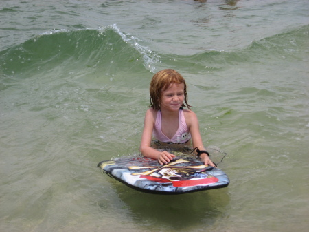 Natalie surfing on the body-board