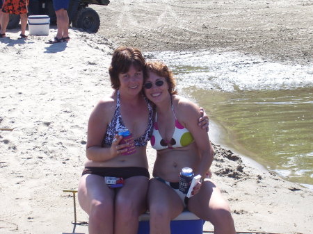 Carrie & Sandi by on the sand bar have a refre