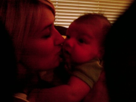 My new grandson Aidan being kissed by his Aunt