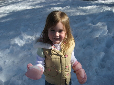 Emma eating snow