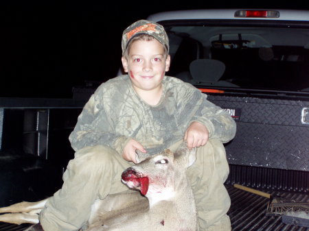 GRANDSON AND HIS FIRST DEER