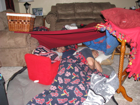 Adam & Daddy sleeping in a fort.