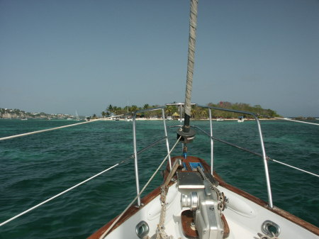 Our sailboat with the Island of Gosier