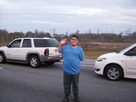 My son Justin Standing on I-95
