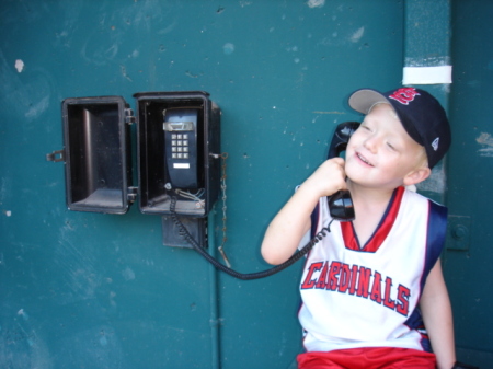 Evan (4 then) answering the bullpen phone