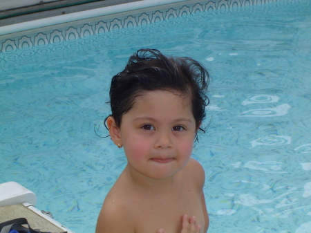My oldest(Isabella) Chillin by our pool