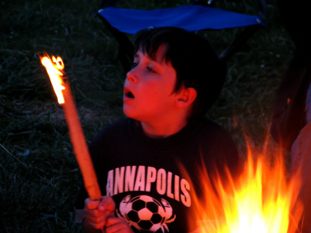 A boy and his flaming marshmallow...