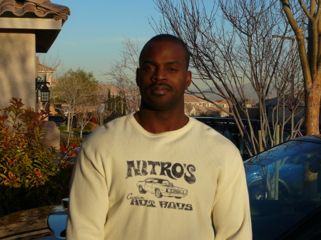 My husband Squeak standing outside our house