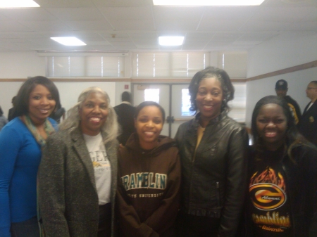 Veronica with Chapter Founder Welcoming a Recent GSU Graduate and Other Grads to the Alumni Chapter.