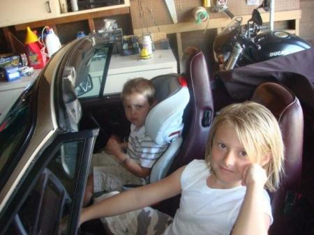 My kids hamming it up in Uncle Mikes car