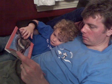 Ethan reads a story to Daddy