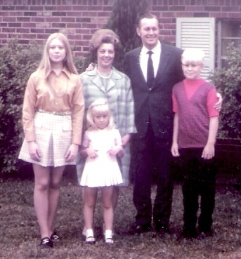 family in front of home 10-11-1970 close-up