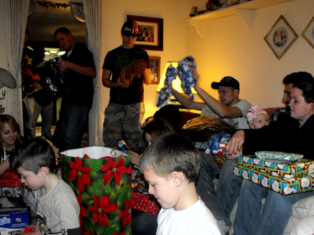 SOME OF THE GRANDKIDS OPENING PRESENTS